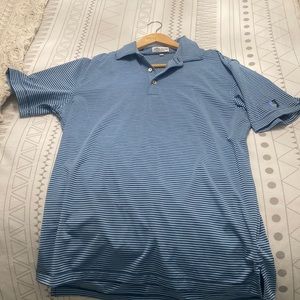 Peter Millar golf shirt with swan embroidered on sleeve